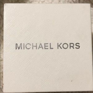 Micheal Kors gold skeleton watch.